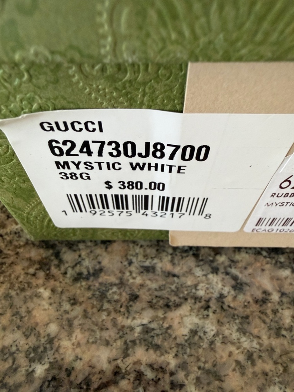 Gucci Women's Ivory Embossed Logo Slide Sandals - Picture 15 of 15